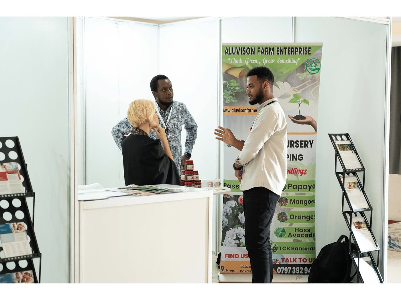 A founder presenting at a startup expo stand